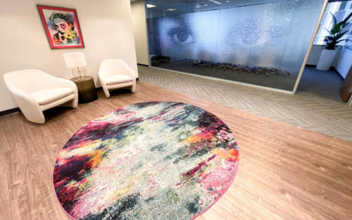 Our lobby welcomes you with vibrant art by Dain and a privacy screen created by InkMonstr in homage to the works of Vhils and Simon Berger.